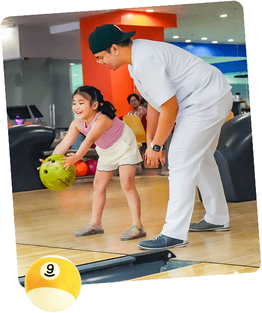 family playing bowling