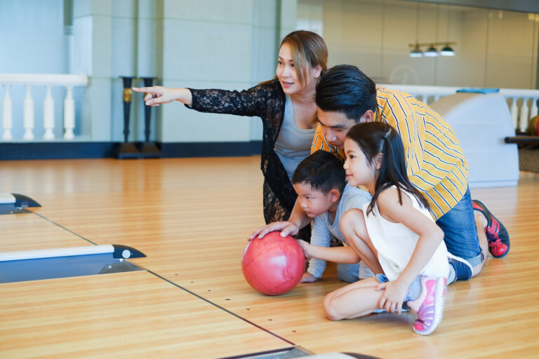a family playing bowling